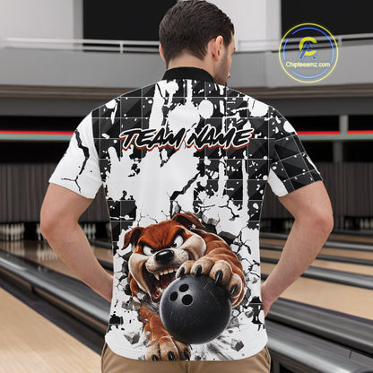 Person wearing a bowling-themed shirt with a dog holding a bowling ball design in a bowling alley.