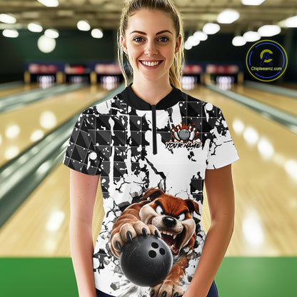 Woman wearing a bowling-themed shirt with a dog graphic in a bowling alley.