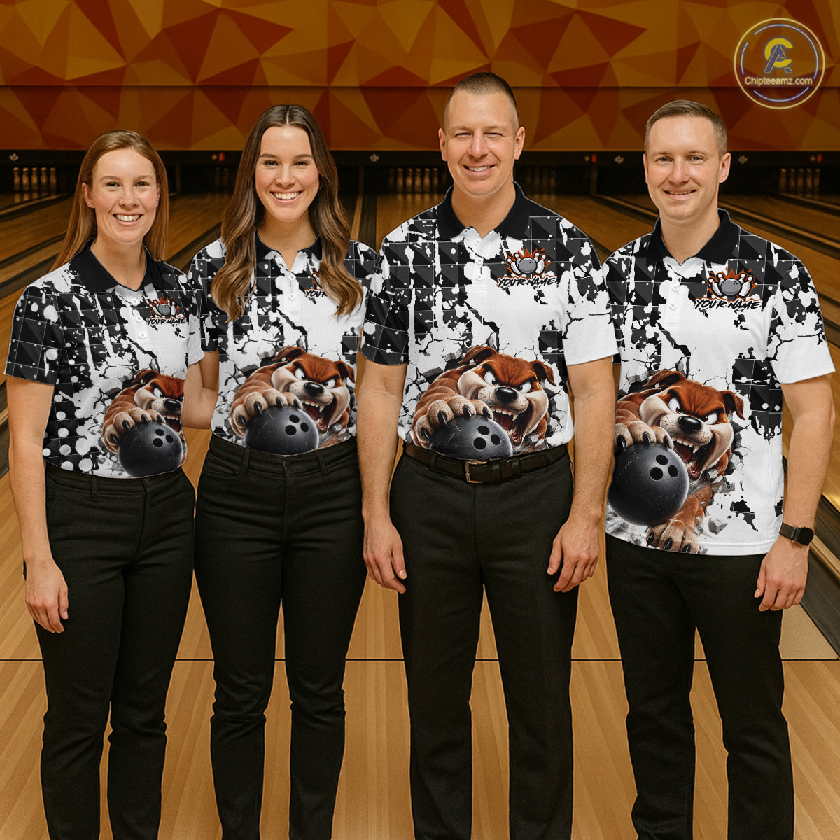 Four people in matching bowling shirts with a dog design on a bowling alley.