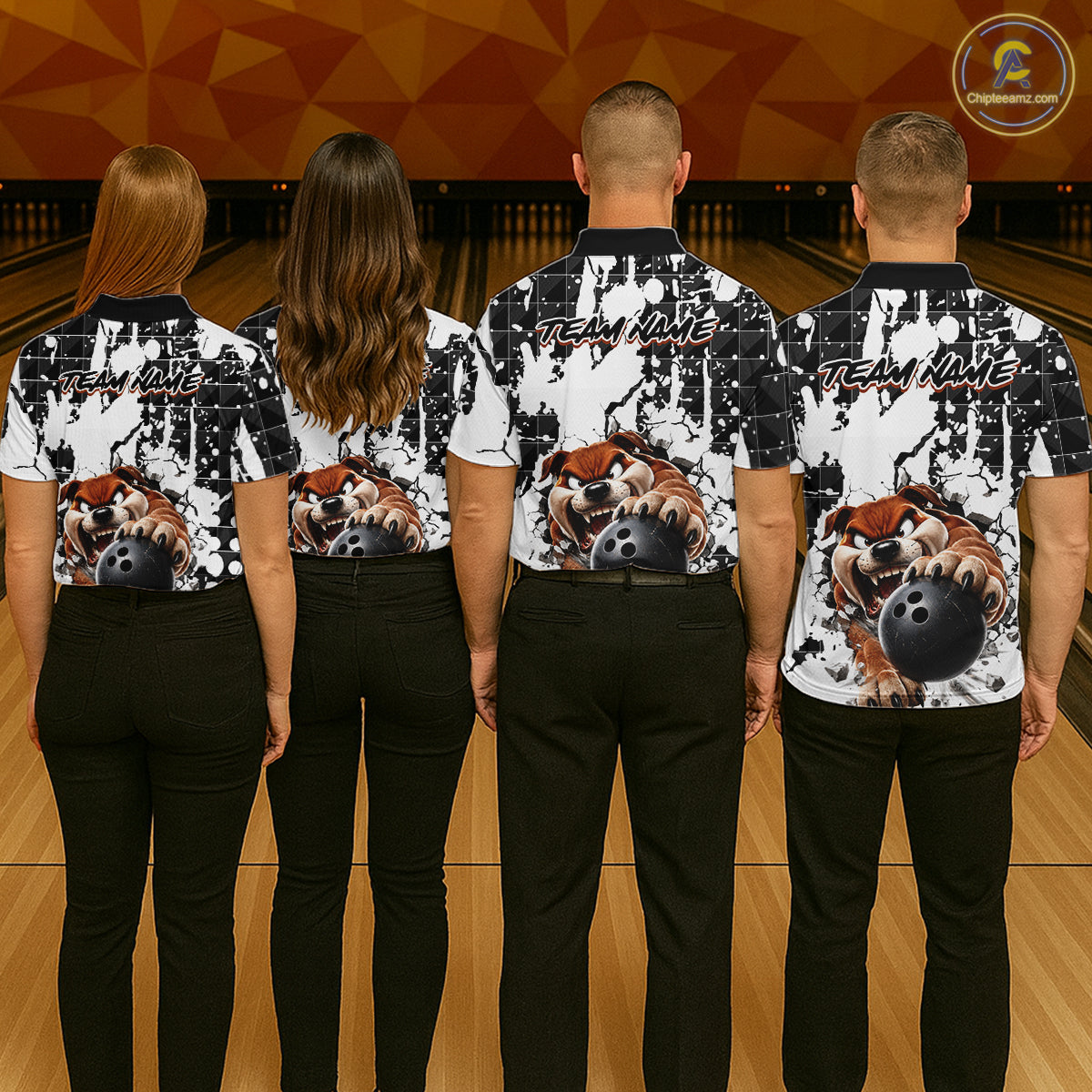 Four people wearing matching bowling shirts with a bulldog and bowling ball design on a bowling alley.
