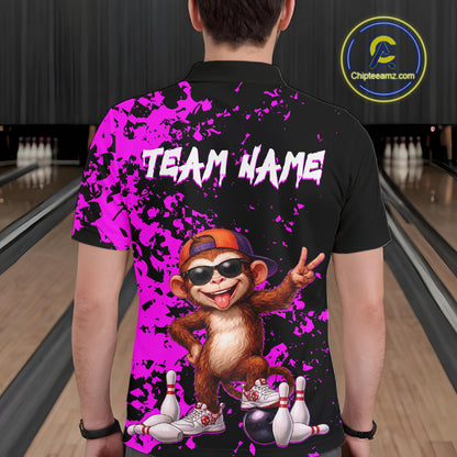 A person shown from the back wearing a black short-sleeve polo shirt with a bright purple paint-splatter design, white 'TEAM NAME' text, and a cartoon monkey graphic in an orange cap and sunglasses. Bowling alley lanes are visible in the background, and a circular 'Chipteamz'.