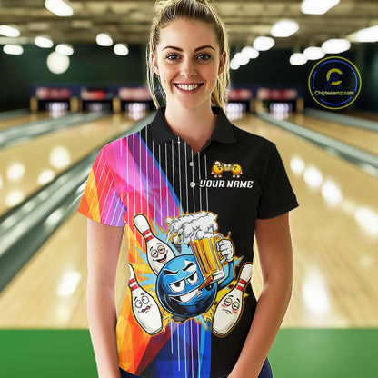 Person wearing a colorful bowling-themed shirt with a black shirt underneath in a bowling alley.