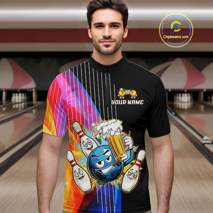 Man wearing a black bowling shirt with colorful design and 'Your Name' text in a bowling alley.