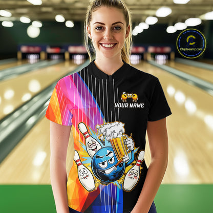 Person wearing a colorful bowling-themed shirt with a graphic design in a bowling alley.
