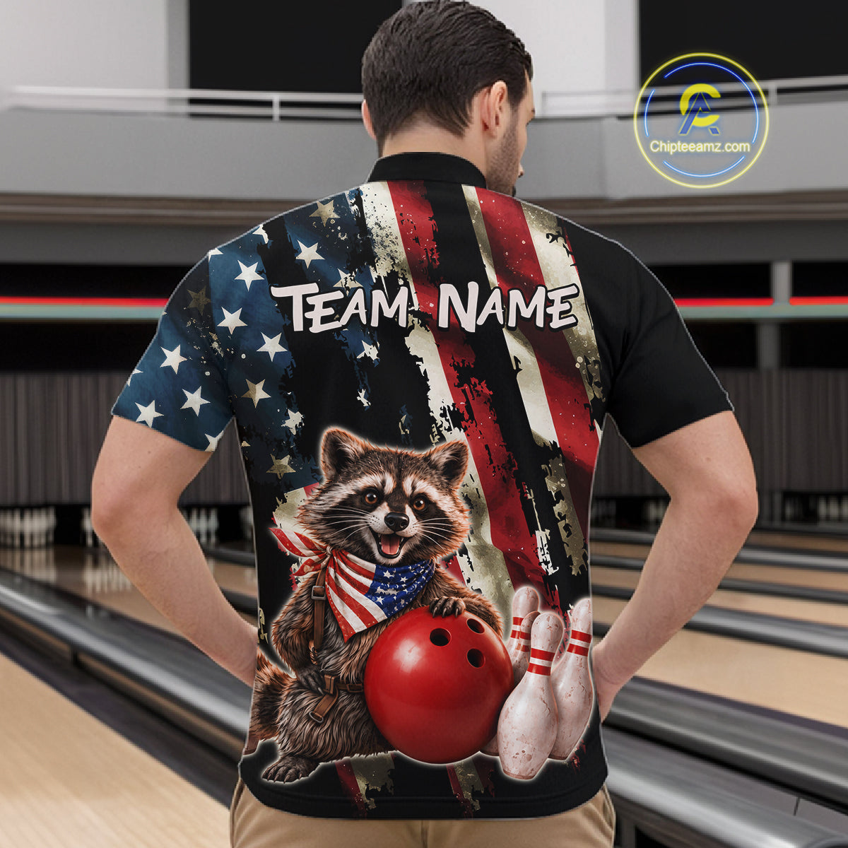 Person wearing a bowling-themed shirt with a raccoon holding a bowling ball and shoes in a bowling alley.