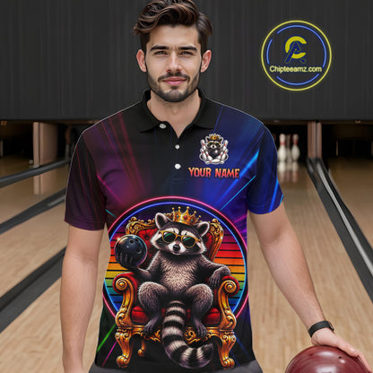 Man wearing a neon polo shirt with a raccoon design in a bowling alley.