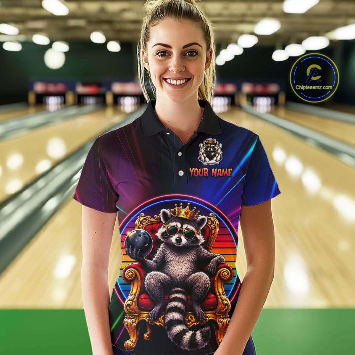 Person wearing a colorful bowling shirt with a raccoon design in a bowling alley.