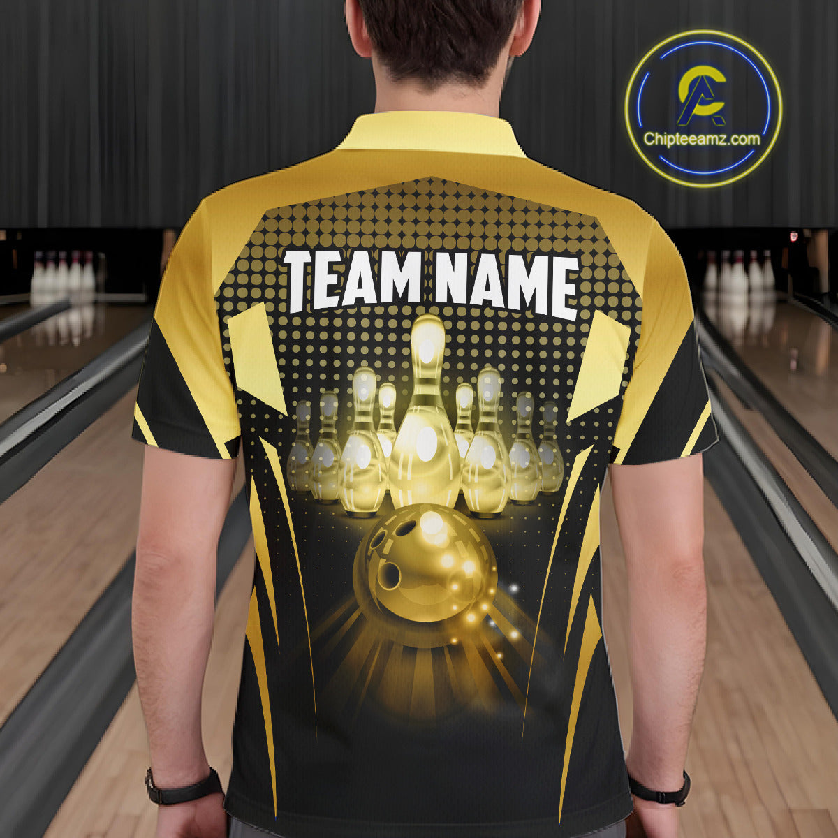 Male model wearing a custom black gold bowling polo shirt back view displaying the personalized team name above a glowing bowling ball and illuminated bowling pins graphic at the bowling alley
