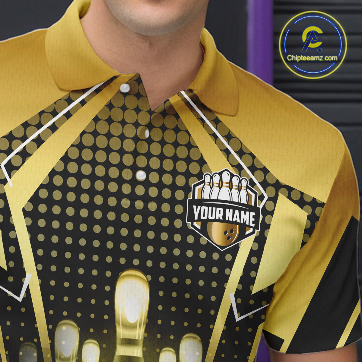 Close-up front view of a custom black gold bowling polo shirt showing the personalized player name, glowing bowling ball graphic and gold geometric light beam design
