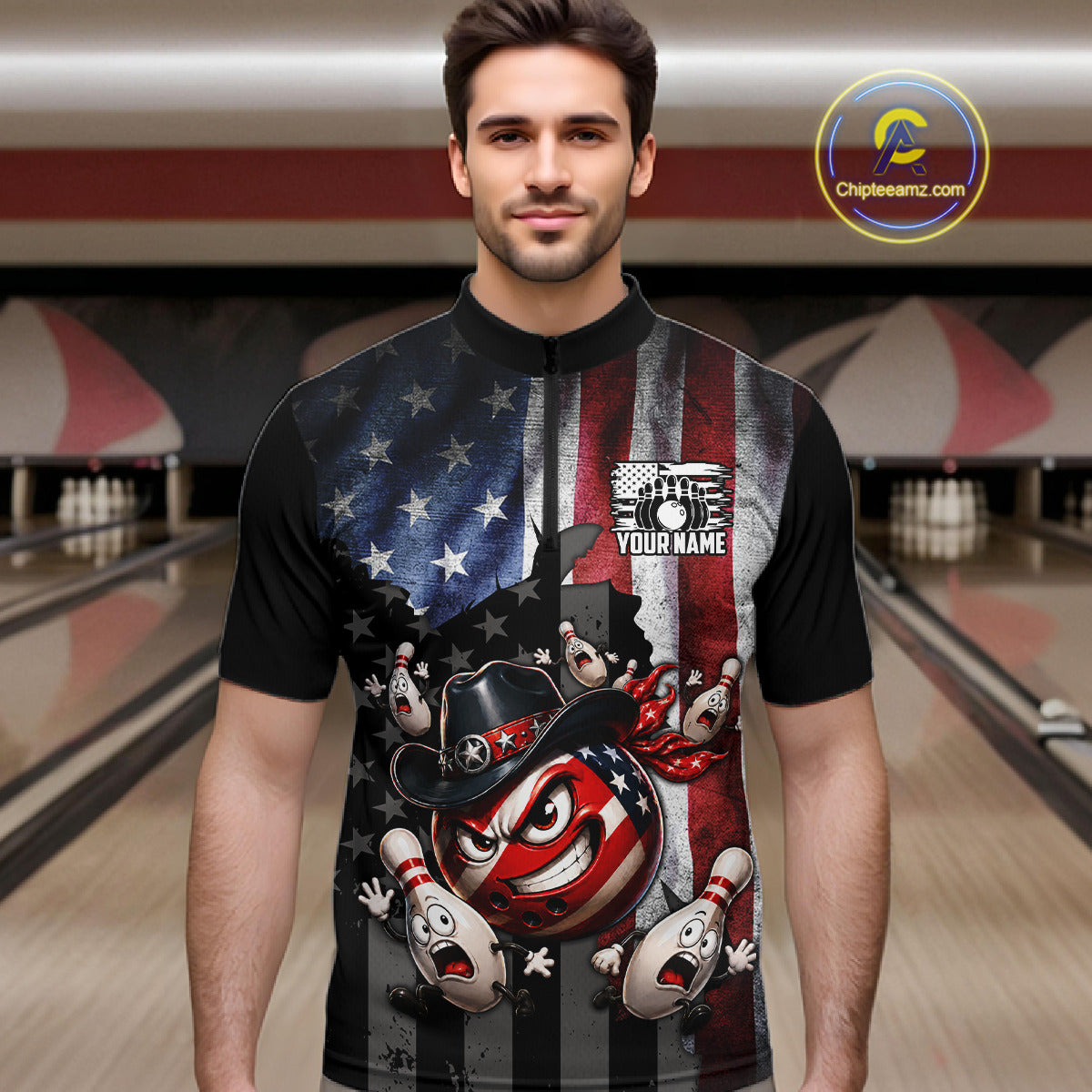Man wearing a black t-shirt with a colorful graphic design in a bowling alley.