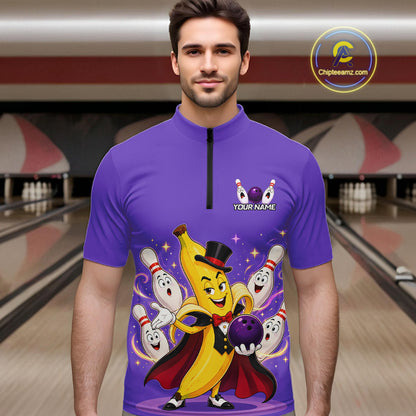 Man wearing a purple shirt with a cartoon character design in a bowling alley.