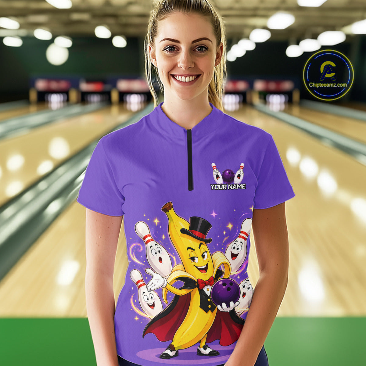 Person wearing a purple bowling shirt with cartoon characters in a bowling alley.