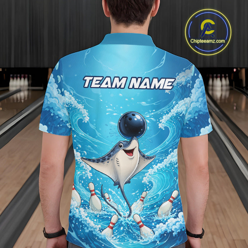 A person viewed from behind wearing a short-sleeve collared shirt with a bright blue ocean-wave graphic and a cartoon ray catching a bowling ball. The shirt has the text 'TEAM NAME' across the upper back.