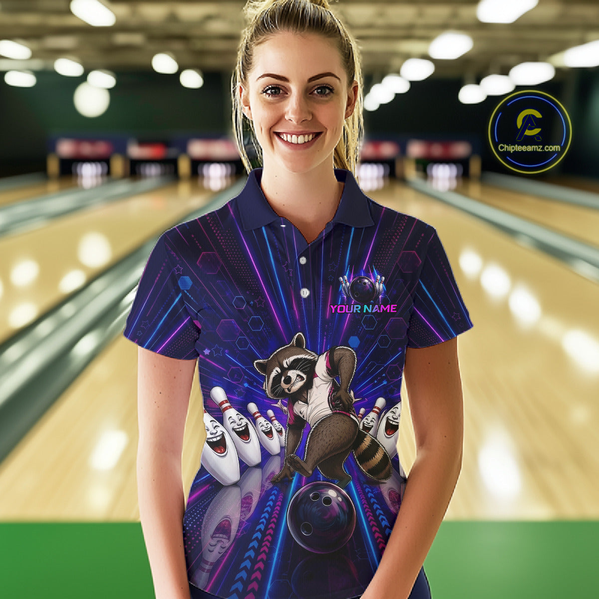 Woman wearing a colorful bowling shirt with a raccoon design in a bowling alley.