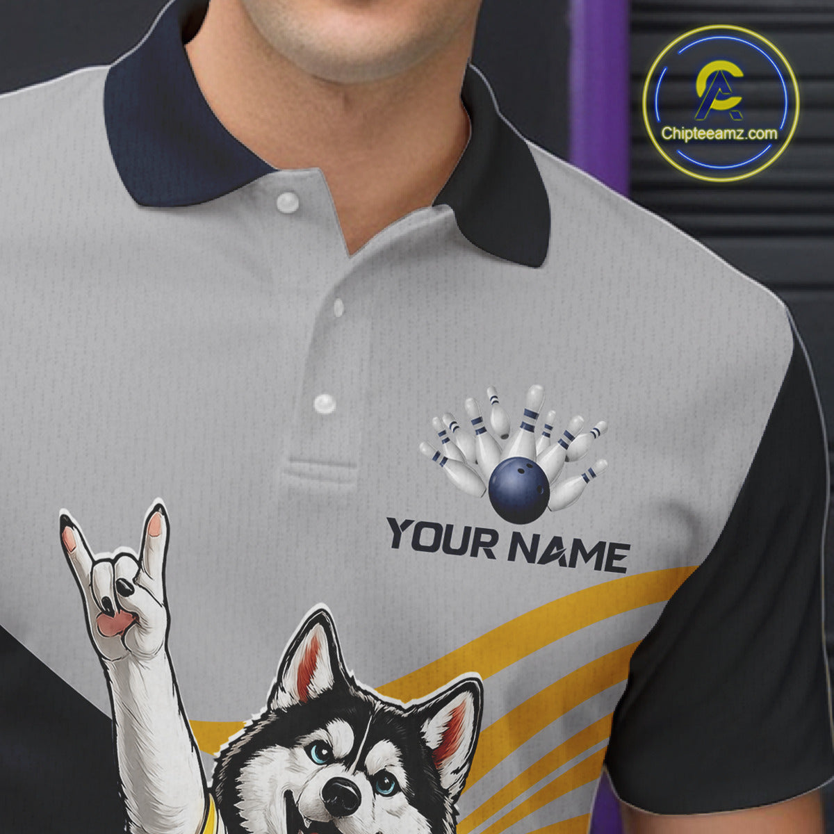 Gray polo shirt with dog and bowling design, customizable text, and visible brand logo.