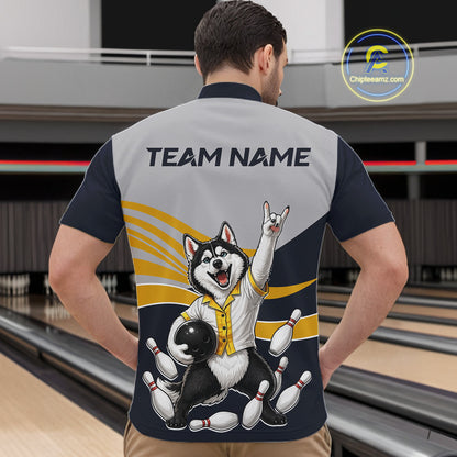 Person wearing a bowling-themed shirt with a dog graphic in a bowling alley.