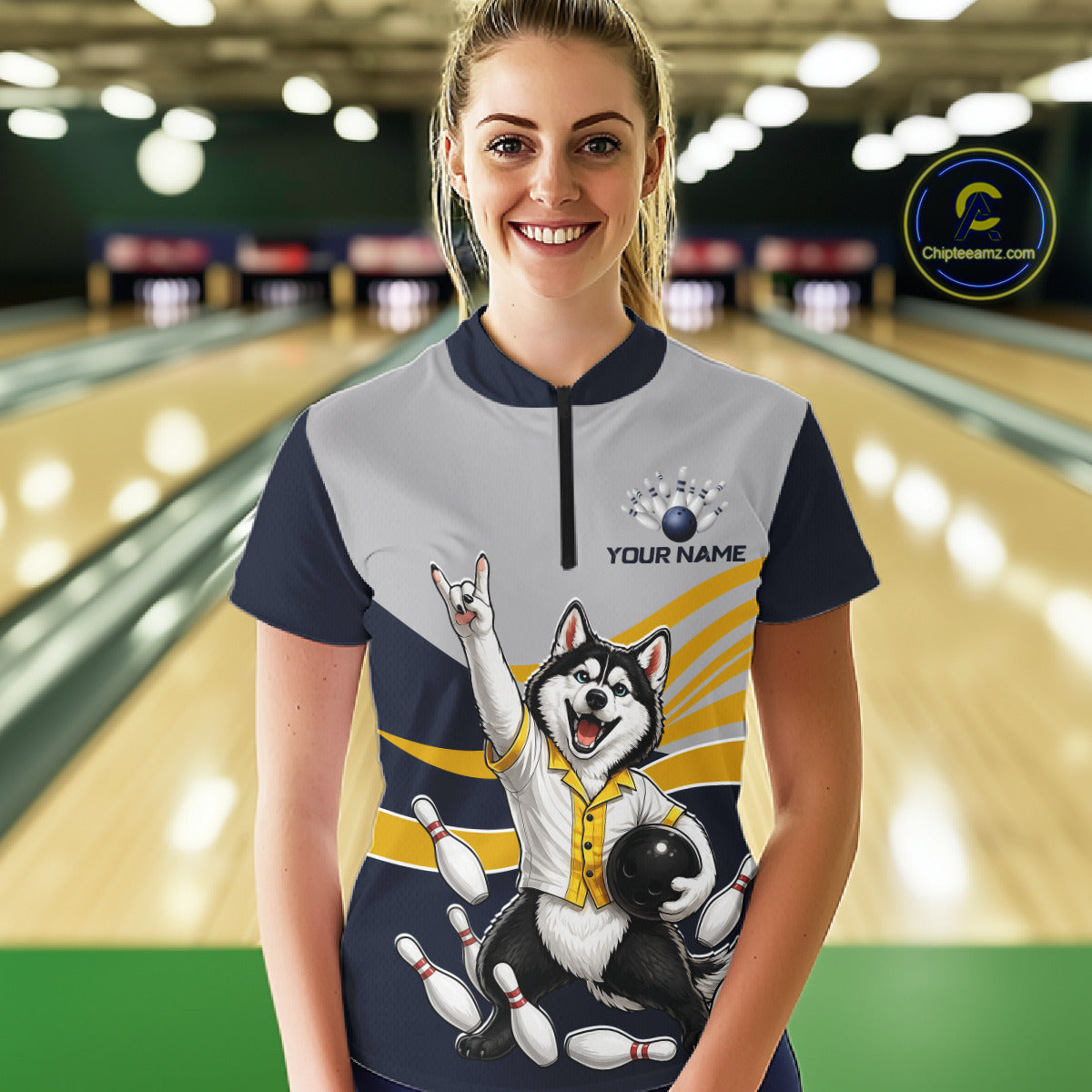 Person wearing a bowling shirt with a dog graphic in a bowling alley