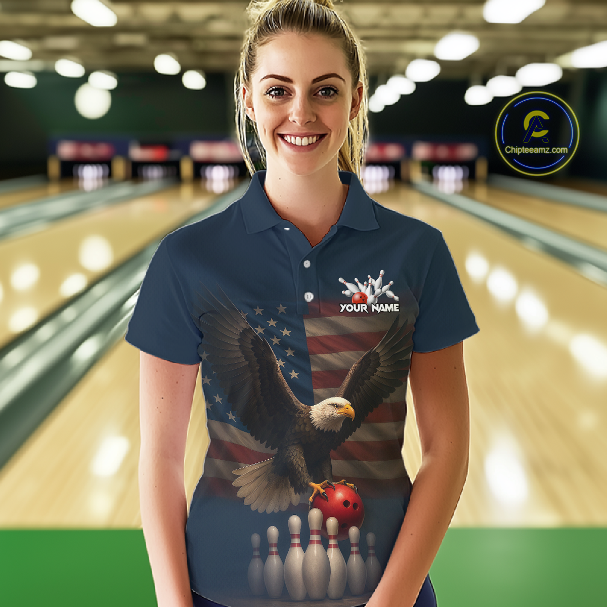 Female model wearing custom navy patriotic bowling polo shirt front view featuring a bald eagle, American flag and bowling pins, displaying Your Name, at the bowling alley