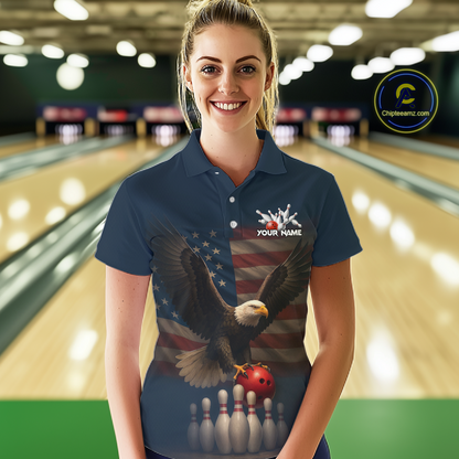 Female model wearing custom navy patriotic bowling polo shirt front view featuring a bald eagle, American flag and bowling pins, displaying Your Name, at the bowling alley