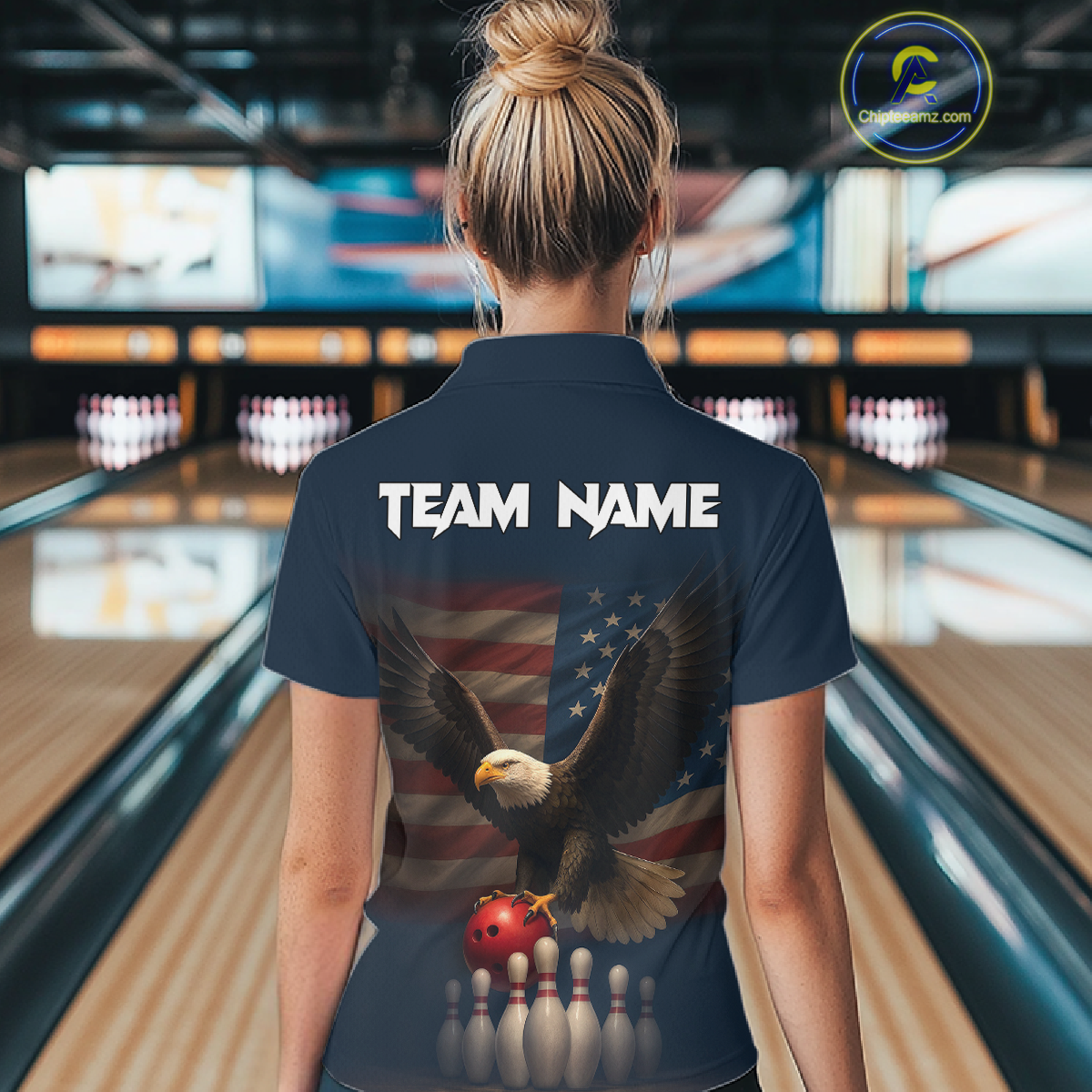 Woman wearing custom navy patriotic bowling polo shirt back view featuring a bald eagle and American flag, displaying Team Name, at the bowling alley