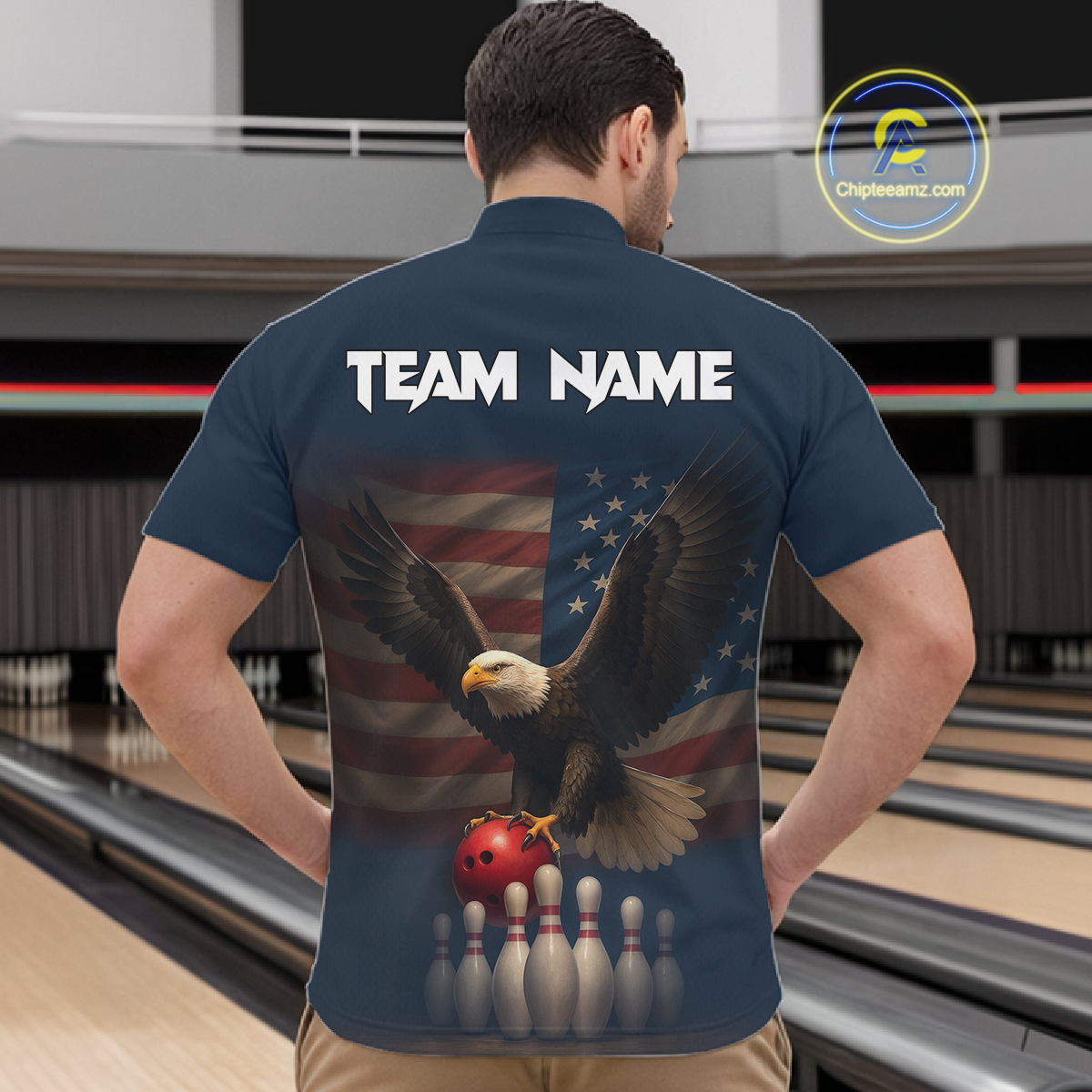 Man wearing custom navy patriotic bowling quarter-zip shirt back view featuring a bald eagle and American flag, displaying Team Name, at the bowling alley