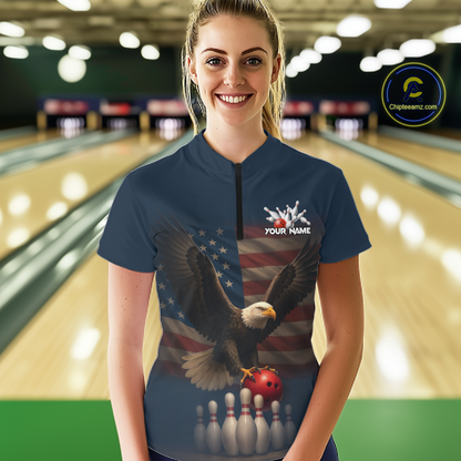 Woman wearing custom navy patriotic bowling quarter-zip shirt front view featuring a bald eagle, American flag and bowling pins, displaying Your Name, at the bowling alley