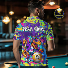 Load image into Gallery viewer, Person wearing a graffiti dinosaur shirt with a dinosaur design and 'Team Name' text, standing in a pool hall.