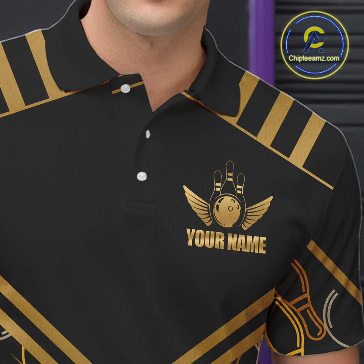 Close-up front view of a custom black gold bowling polo shirt showing the personalized player name, golden winged bowling ball emblem and geometric line design