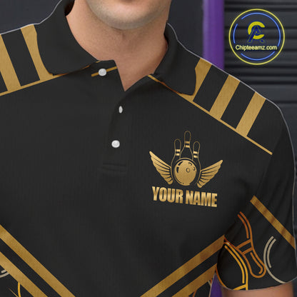 Close-up front view of a custom black gold bowling polo shirt showing the personalized player name, golden winged bowling ball emblem and geometric line design