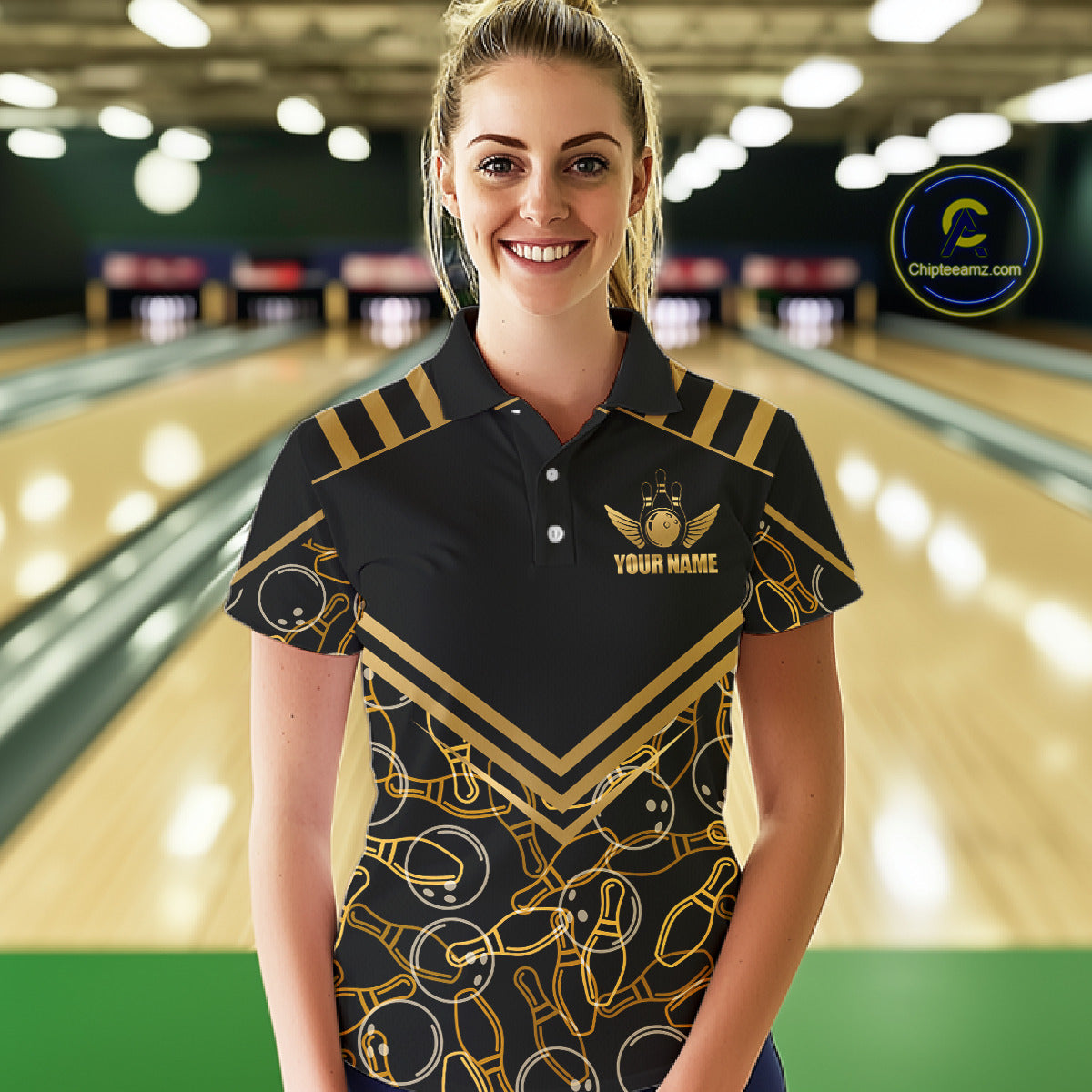 Female model wearing a custom black gold bowling polo shirt front view featuring a golden winged bowling ball emblem, geometric line pattern and premium black gold design at the bowling alley