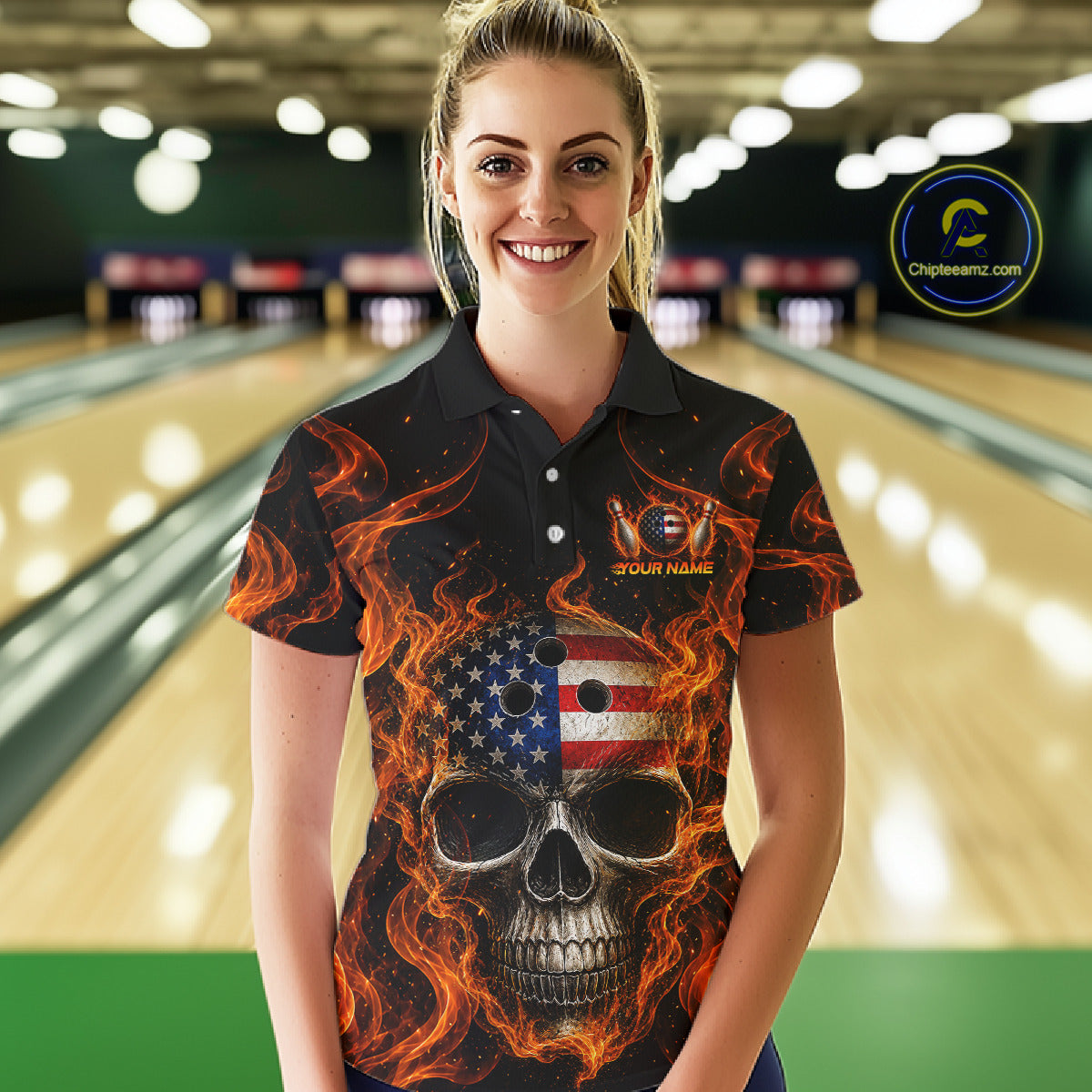 Woman wearing a black bowling shirt with a skull and American flag design in a bowling alley.