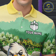 Load image into Gallery viewer, Green and yellow polo shirt with a cartoon character and customizable text on a blurred background