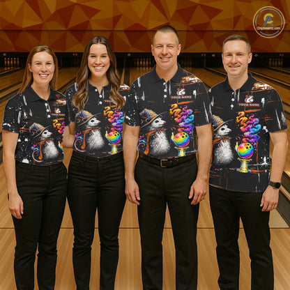 Four people standing together in a bowling alley wearing matching black short-sleeve bowling shirts with a colorful opossum and rainbow bowling graphic, paired with black pants.