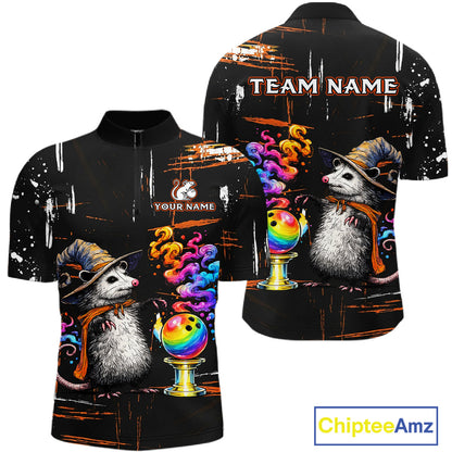 A black short-sleeve polo shirt shown from both front and back, featuring a colorful printed design of an opossum wearing a cowboy hat and scarf beside a rainbow bowling ball on a stand, with customizable text placeholders 'TEAM NAME' and 'YOUR NAME'.