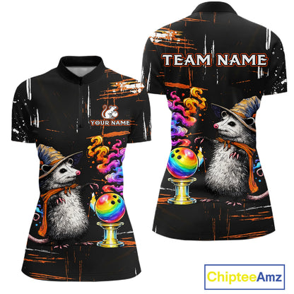 A black short-sleeve polo shirt shown from the front and back, featuring a printed design of two gray hedgehogs wearing witch hats beside colorful rainbow bowling balls on gold stands, with customizable text areas reading 'TEAM NAME' and 'YOUR NAME'. The background is plain white.