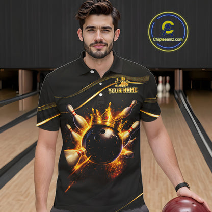 Man wearing custom black gold bowling polo shirt front view featuring a fiery bowling ball and flame burst effect, displaying Your Name, at the bowling alley