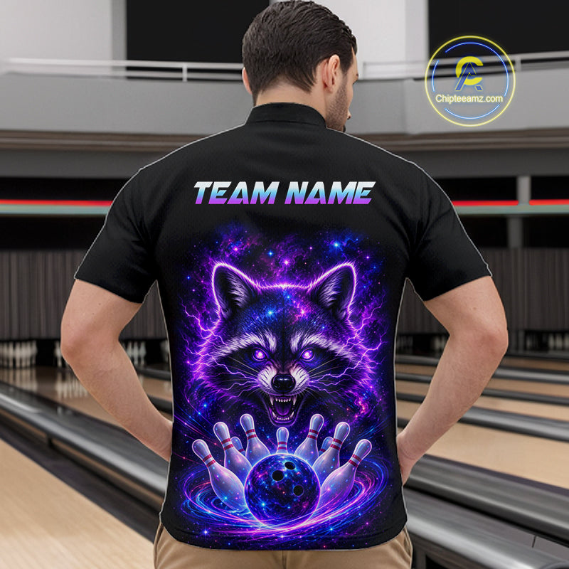 A man viewed from behind wearing a black short-sleeve bowling shirt with a large colorful back graphic of a glowing raccoon and bowling pins, with the text 'TEAM NAME' across the upper back. Bowling lanes are visible in the background, and a 'Chipstreamz.