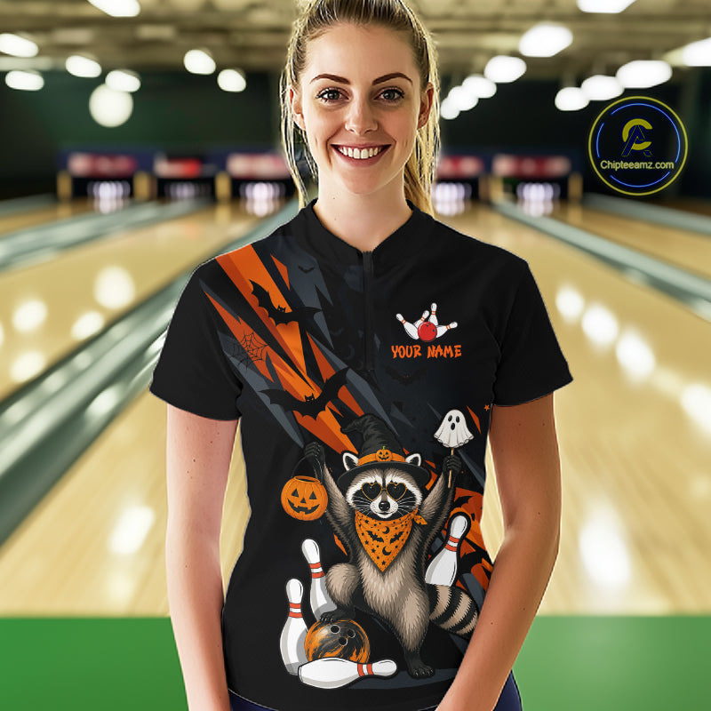 Women wearing a black Halloween bowling quarter zip featuring a raccoon wearing an orange bandana, ghost and pumpkin accents, bowling pins and ball, with personalized name and team name text.