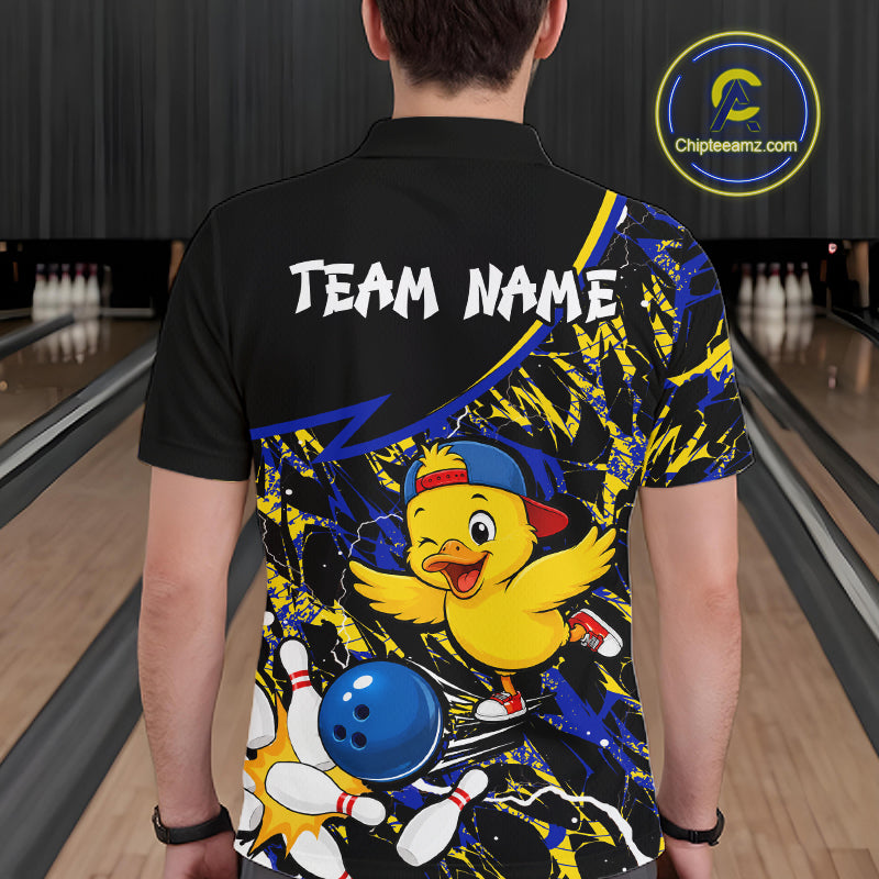 Person wearing a colorful bowling-themed shirt with a cartoon duck character in a bowling alley.