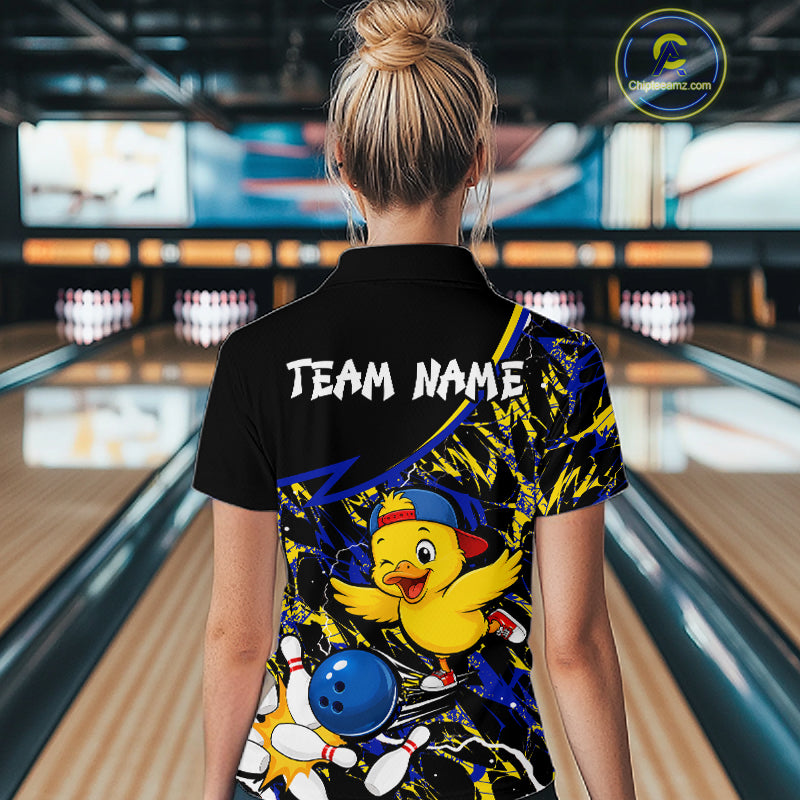 Person wearing a colorful bowling shirt with a duck design in a bowling alley.