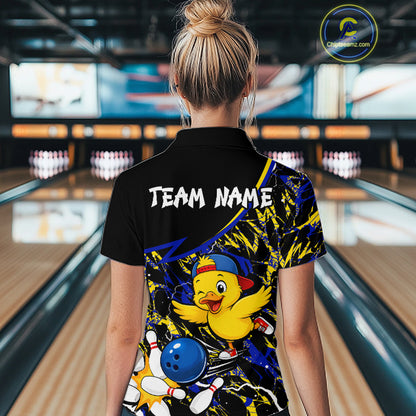 Person wearing a colorful bowling shirt with a duck design in a bowling alley.