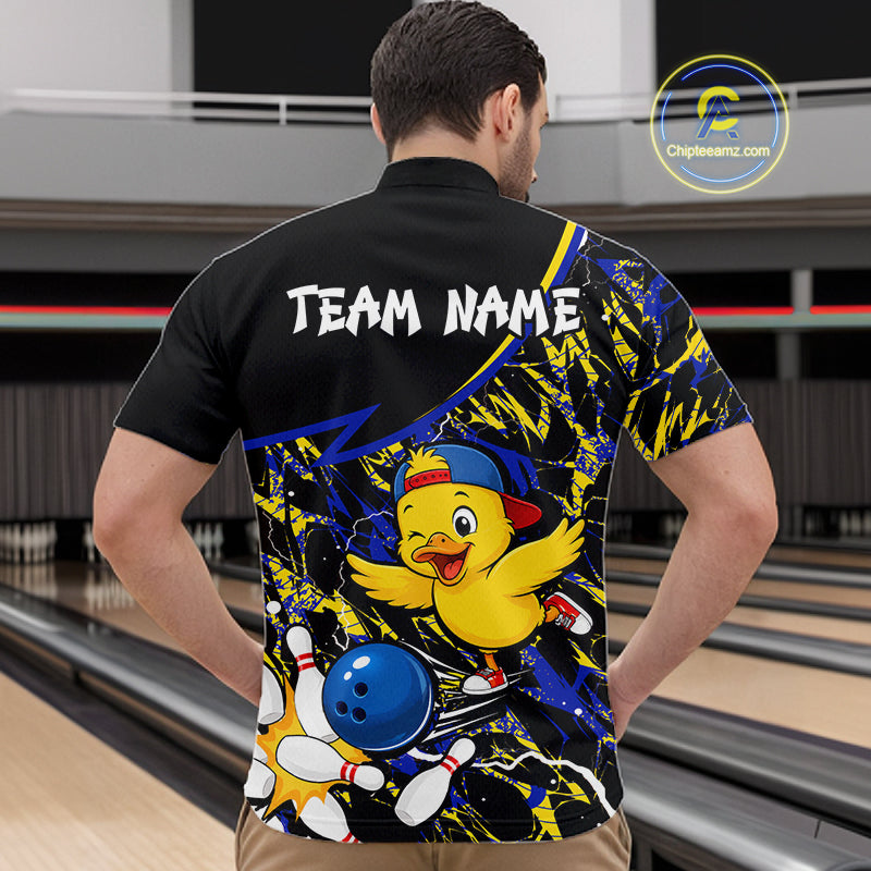 Person wearing a colorful bowling shirt with a duck graphic in a bowling alley.
