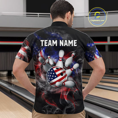 Man wearing a black bowling shirt with American flag design and 'TEAM NAME' text at a bowling alley.