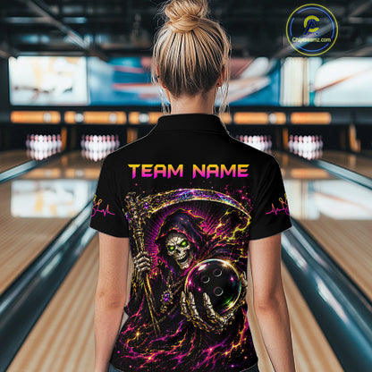 Person wearing a black shirt with colorful design and 'TEAM NAME' text in a bowling alley.