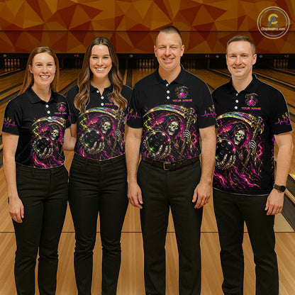 Four people wearing matching black shirts with colorful designs in a bowling alley.
