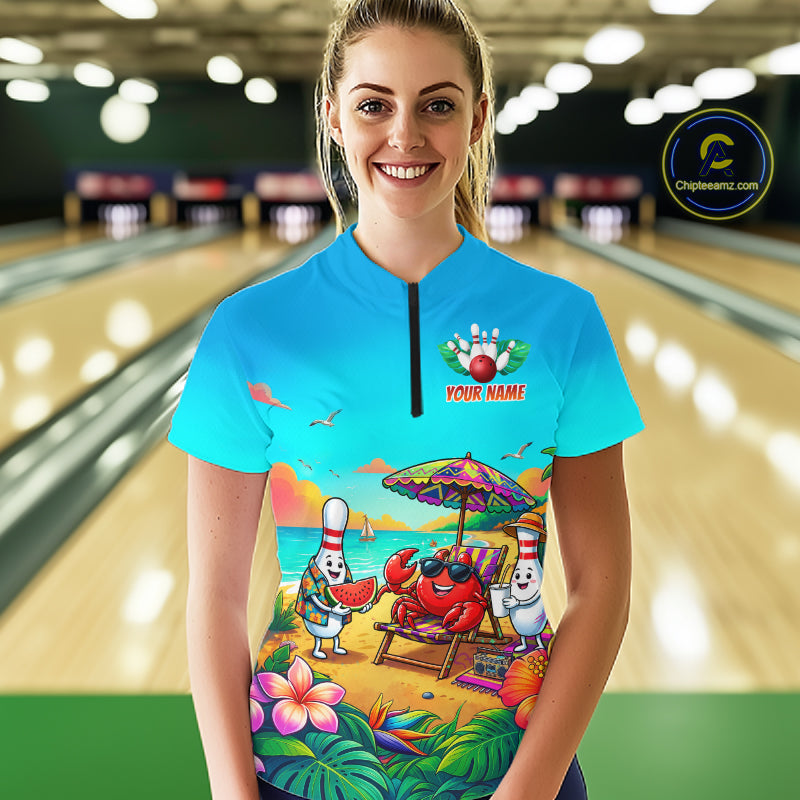 Person wearing a colorful bowling shirt with a beach-themed design in a bowling alley.