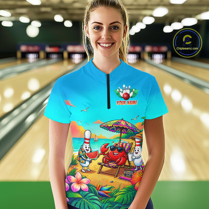 Person wearing a colorful bowling shirt with a beach-themed design in a bowling alley.