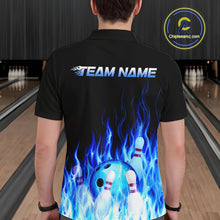Load image into Gallery viewer, Person wearing a black bowling shirt with blue flames and 'TEAM NAME' text in a bowling alley.