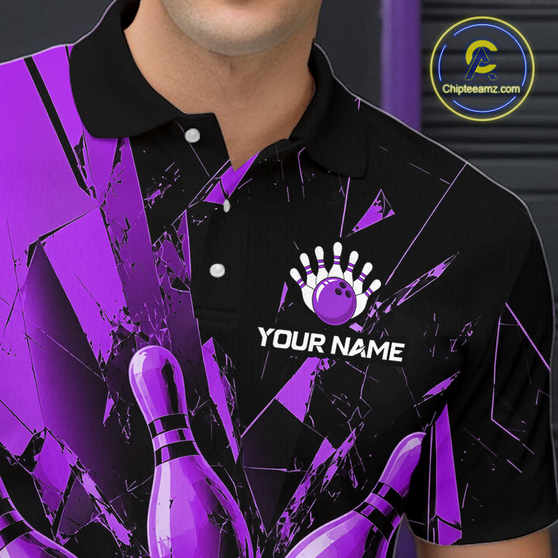 A close-up of a person wearing a black and purple bowling-themed polo shirt with a cracked glass design, bowling pins, and a bowling pin hand graphic on the chest. The shirt has white buttons and a white 'YOUR NAME' text area on the front.