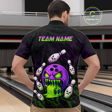 Load image into Gallery viewer, Person wearing a black bowling shirt with colorful design and 'TEAM NAME' text at a bowling alley.